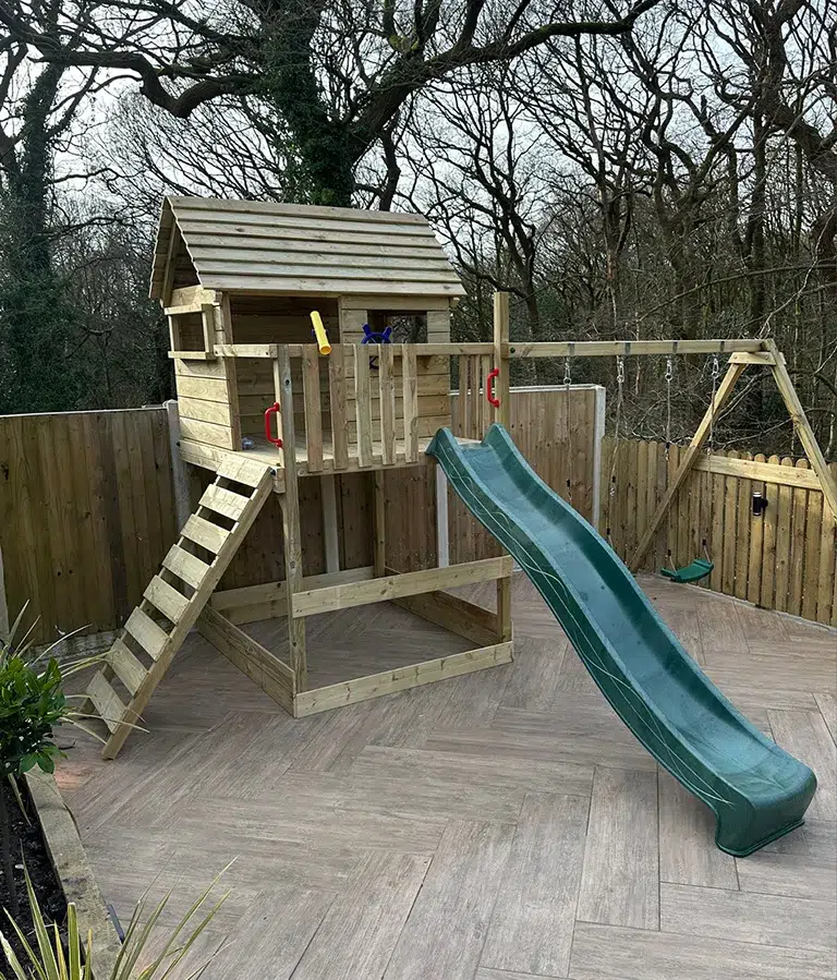 CSG Plastics & Build | Landscaping new Wooden children's playhouse with slide and climbing frame